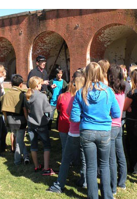 Ranger leading students around fort. Ranger leading students around fort.