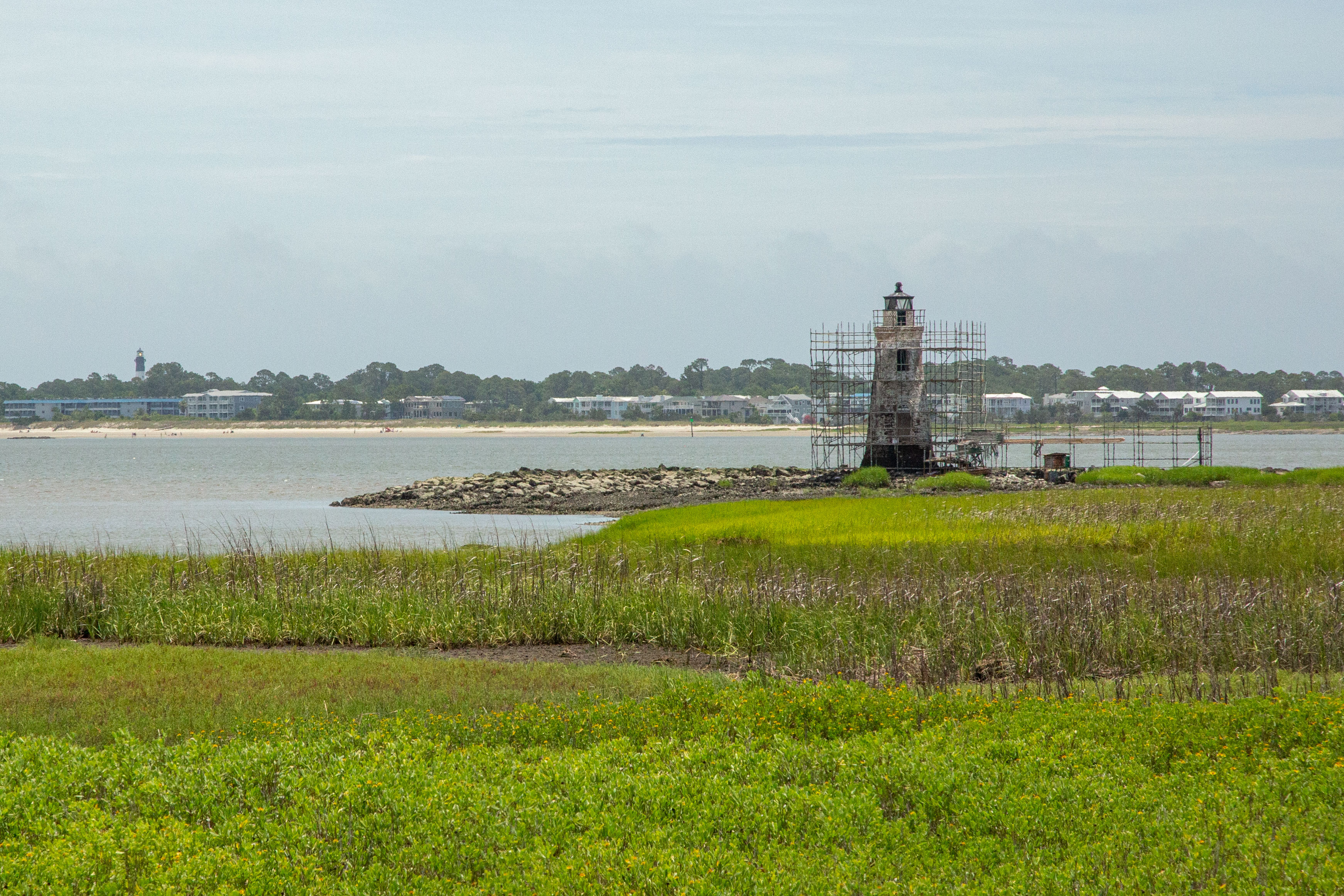 Cockspur Lighthouse Preservation Work Scaffolding Scaffolding surrounds the small 46 foot tall white lighthouse