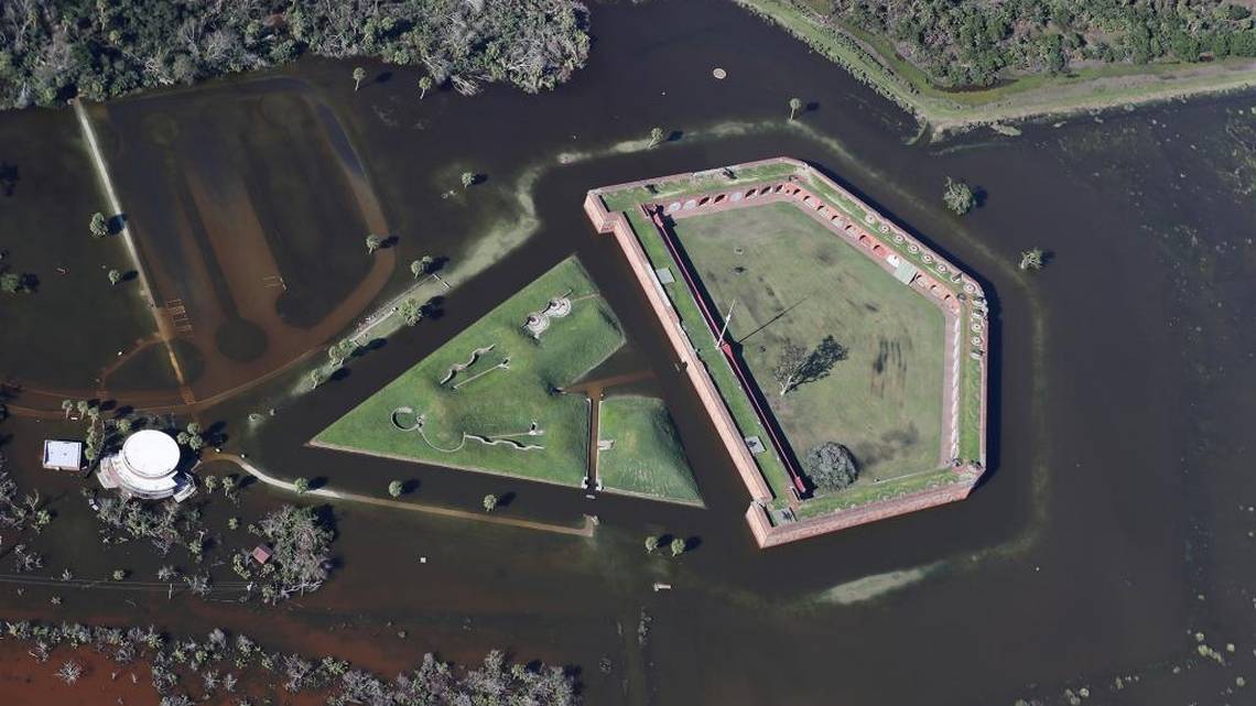 Flood waters surround Fort Pulaski after Hurricane Irma. A hexagonal brick fort is surrounded by flood waters.