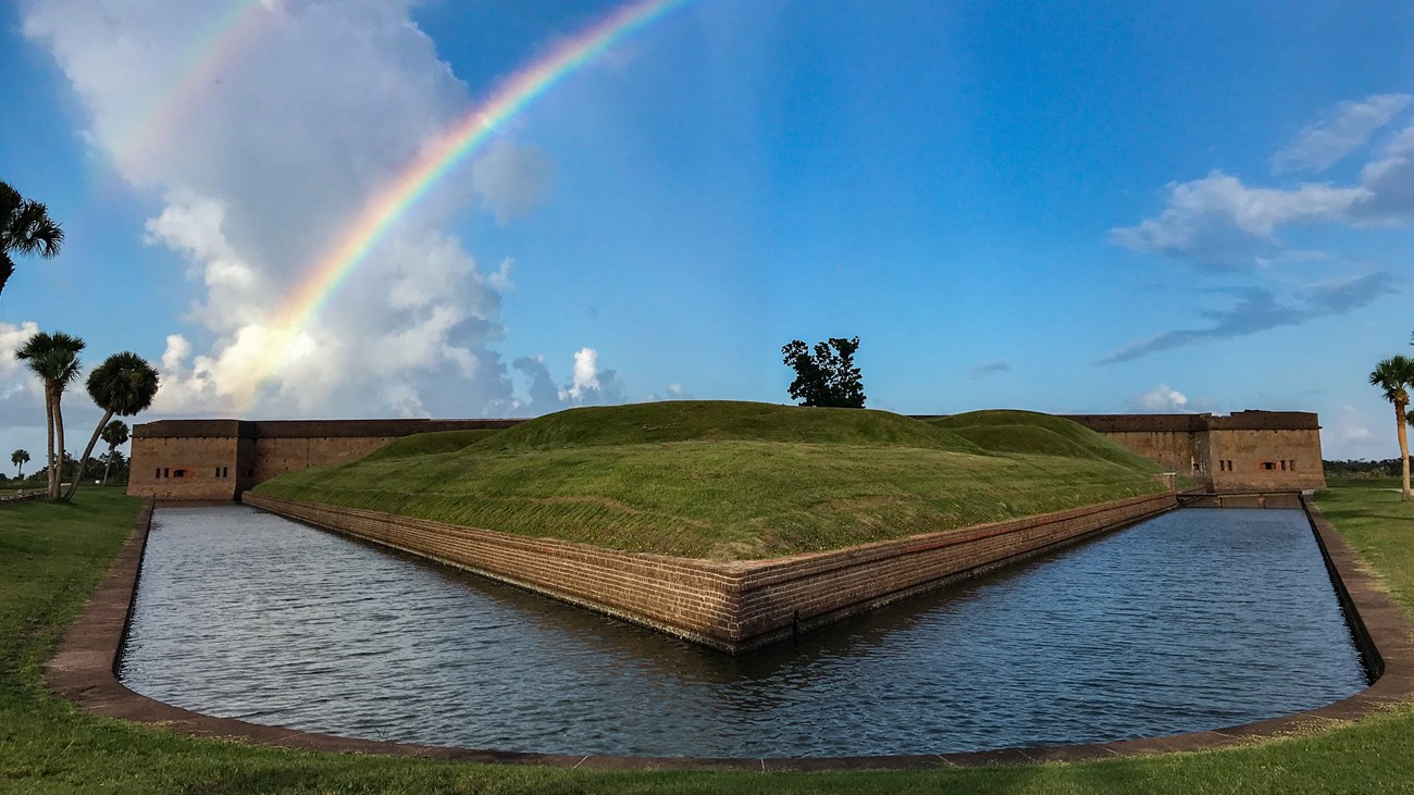 A rainbow rises out of the masonry walls of Fort Pulaski.