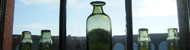 Jamestown glass on display inside Sutler Store