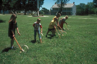 Children using Hoop and Stick