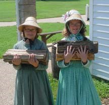 Children carrying firewood