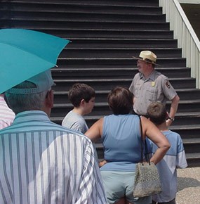 Ranger giving guided tour of fort Ranger giving guided tour of fort