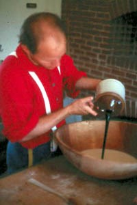 Adding Molasses to Bread Mixture Adding Molasses to Bread Mixture