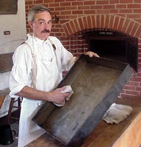 Baker Cleaning a Pan