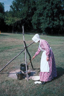 Park VIP Sandy Wells demonstrates the begininng of the soapmaking process.