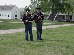 Reenactors handling weapons