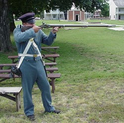 Soldier firing weapon