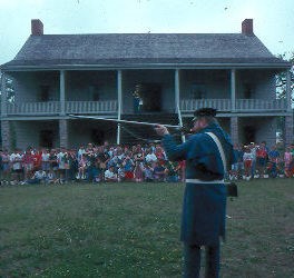 Soldier demonstrating weapons for education program