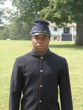 Young black man in soldier uniform