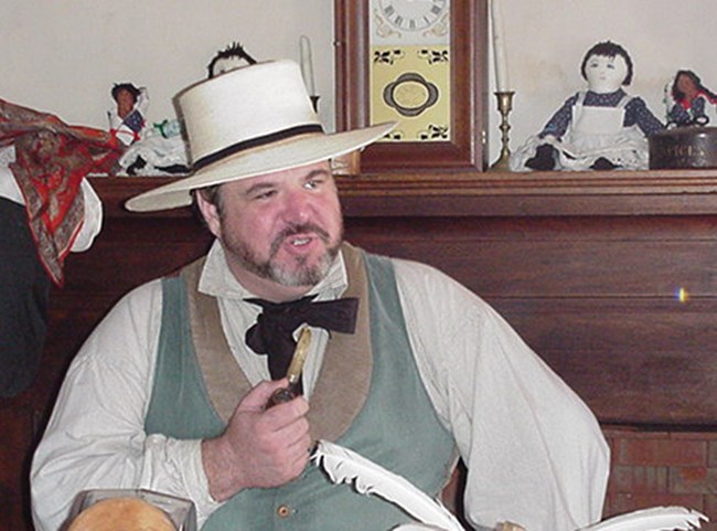 man with beard and white hat