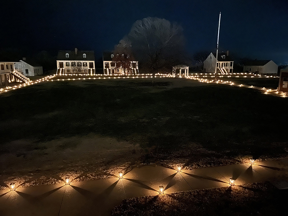 Candle lanterns around the parade ground, lighting the fort.