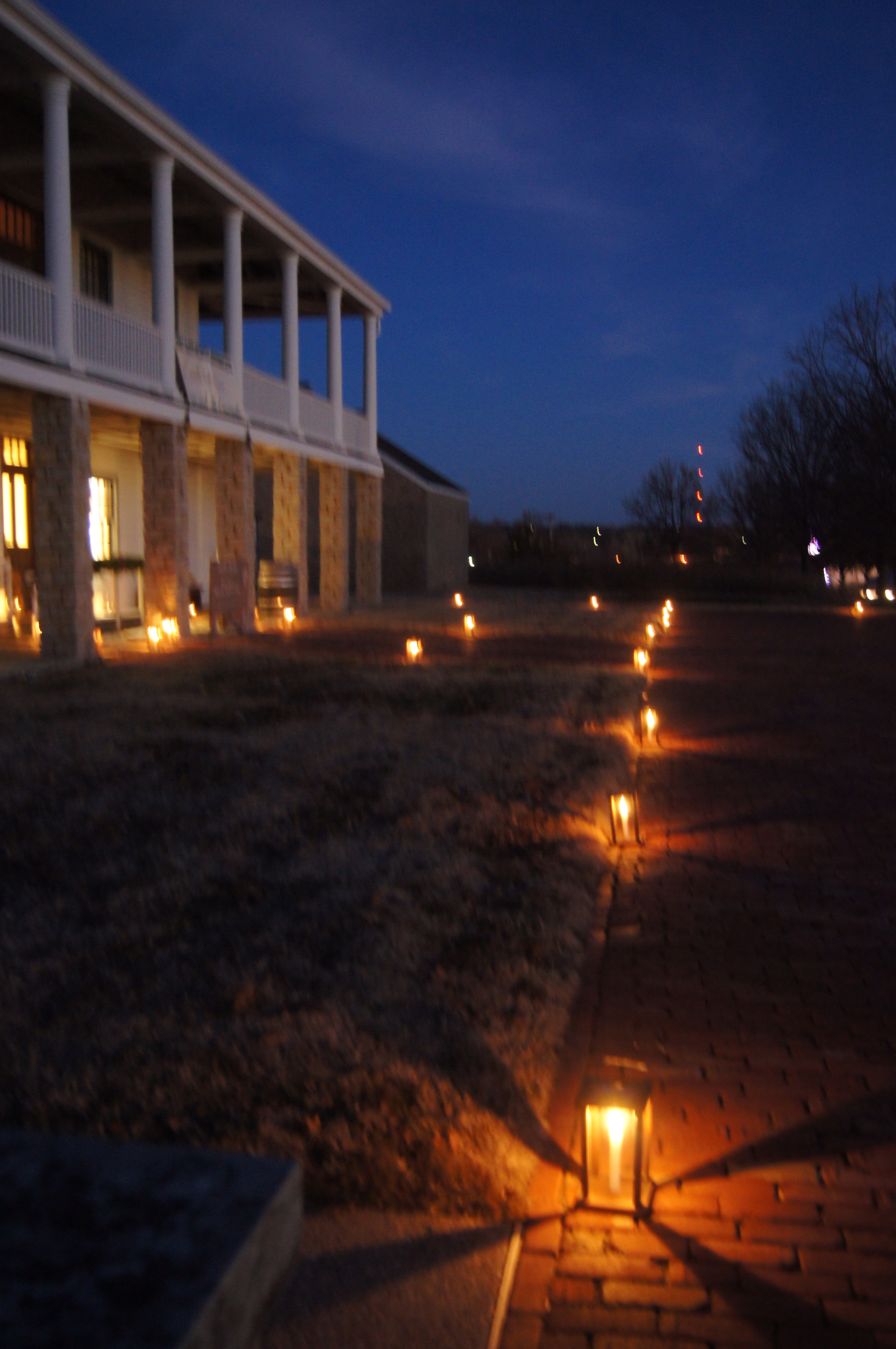 Line of lanterns along a pathway leading to a building
