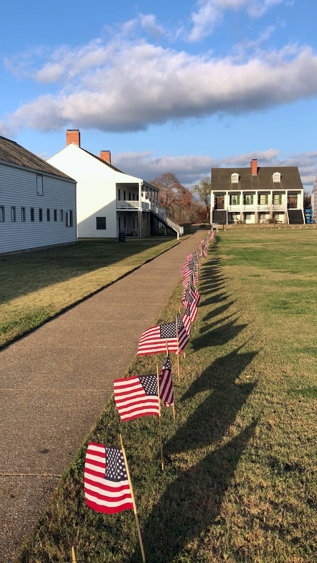 A line of lining the perimeter of the fort's parade ground. Looking down a line of miniature flags lining the perimeter of the fort's parade ground.