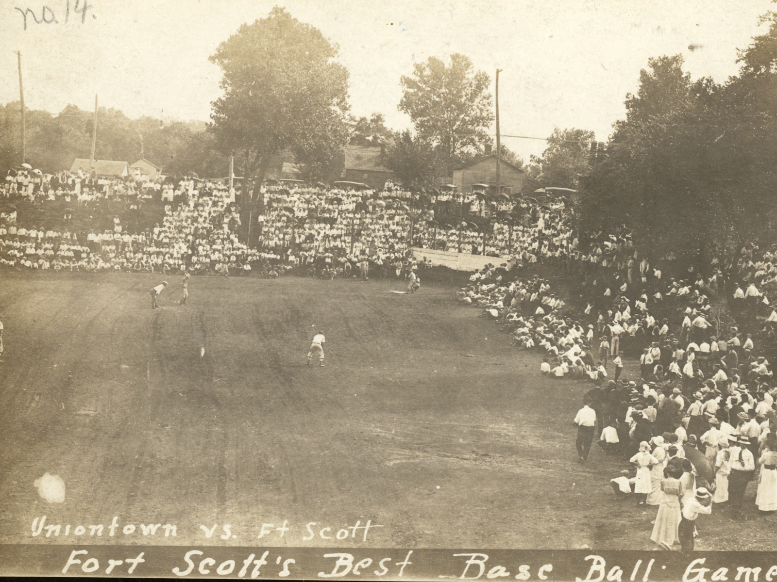 People attending a baseball game in the early 20th century