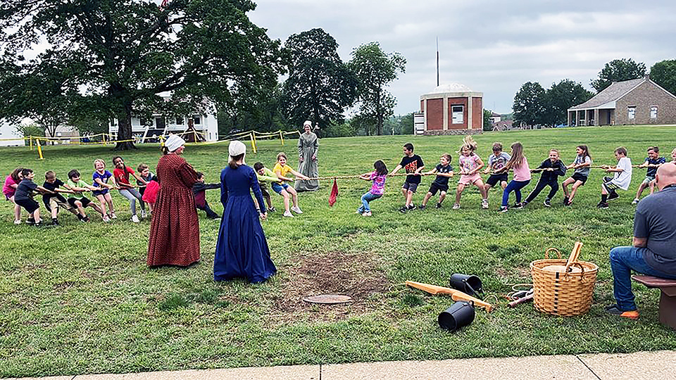 Children playing tug-o-war. Children playing tug-o-war.