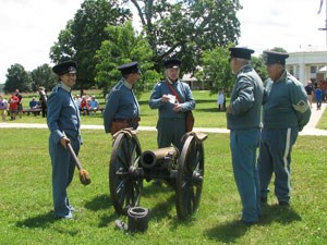 Artillery Crew at Fort Scott people dressed as soldiers near cannon