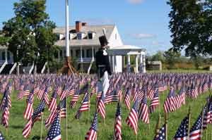 Field of flags with 1840s guard on patrol