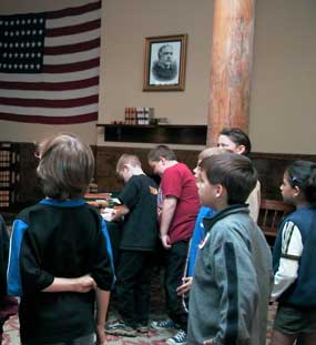 students in courtroom with flag hanging on back wall