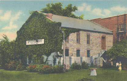 colorized photo of Commissary showing two people standing off to right