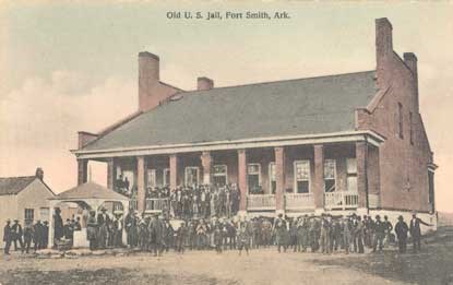 sepia postcard of people standing on grounds of old jail building sepia postcard of people standing on grounds of old jail building