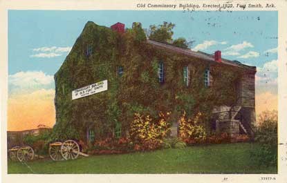 colorized postcard of Commissary with museum sign on building