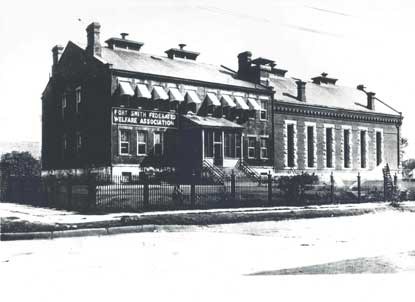 Fort Smith Federated Welfare Association painted on former courthouse building during Welfare Era