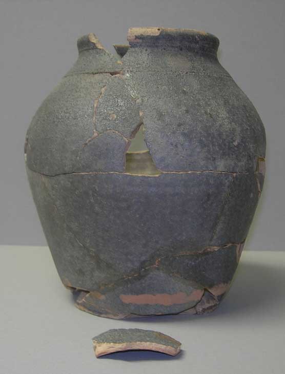 large earthenware jug that shows fragments pieced together