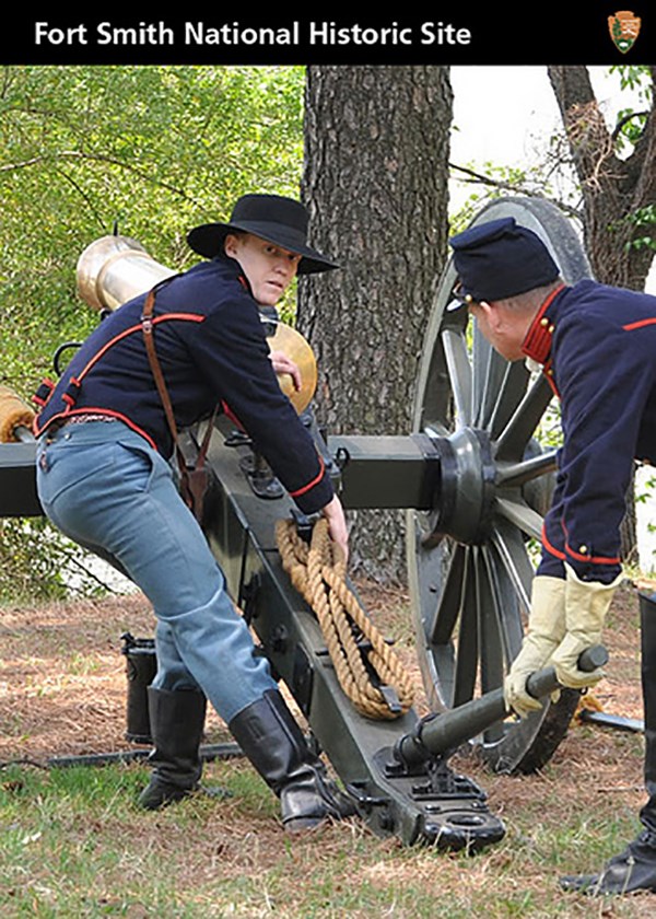 Photo of reenactors - two union soldiers aiming a cannon