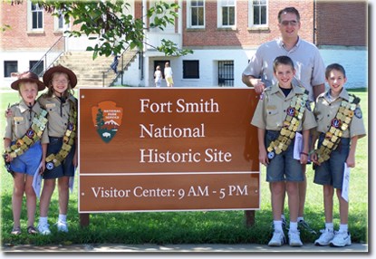 Veteran Jr. Rangers pose by the Fort Smith National Historic Site Welcome Sign. Veteran Jr. Rangers pose by the Fort Smith National Historic Site Welcome Sign.
