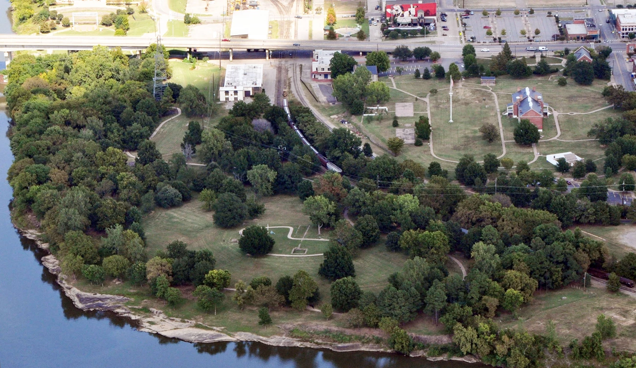 Aerial View of Park - FOSM Aerial view of park grounds parts of several building and sidewalks are visible between trees