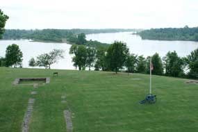 aerial view of Arkansas River with foundation remains of first fort in foreground