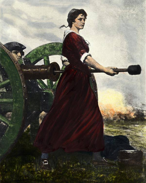 A woman in a long skirt stands boldly with her back to a cannon holding a cannon implement in her hands. i