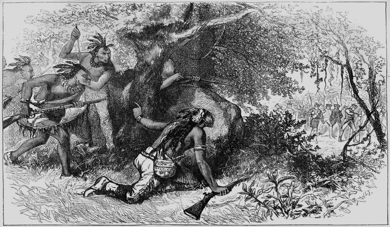 Several men in native garb, shirtless with hair feathers, spy on a distant group of European soldiers through a clump of bushes.