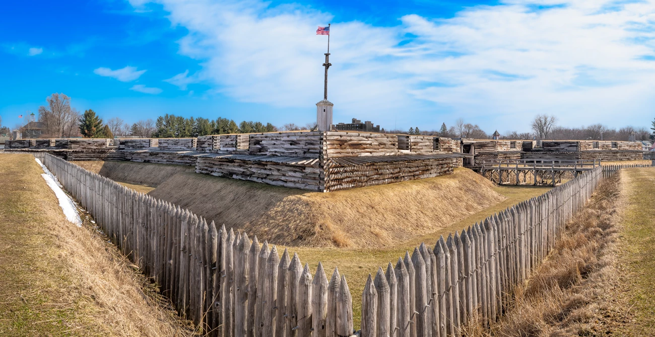 DSC_6349-Pano Horizontally in front of you, the wooden flagpole rises from the fort's large walls.