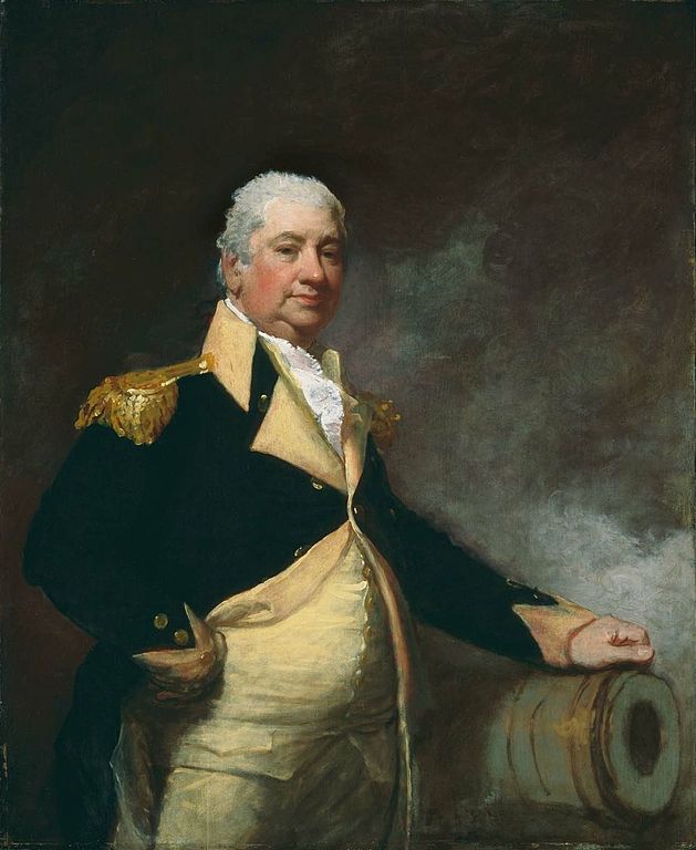 629px-Henry_Knox_by_Gilbert_Stuart_1806 An older man stands in front of a brass cannon with his hand resting on it. He is portly with short hair. His jacket has gold embellishments.