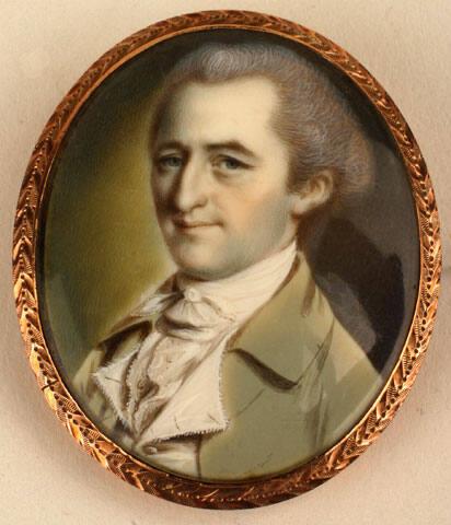 A portrait of a young man with neatly trimmed and powdered hair. He wears a smile, has high cheekbones, and a distinctive nose. 