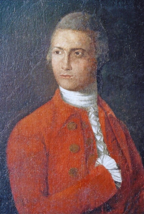 Picture3.J.Johnson He wears a white shirt with ruffles at the neck and a white neckcloth wrapped tight around his throat. His coat and vest are a brick red color. He rests his right hand inside his vest.