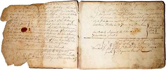 The torn pages of the old book are laid open in front of you.
