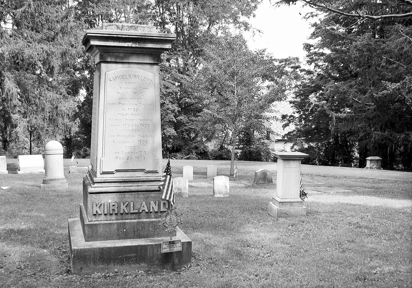 A photo of a small obelisk that says 