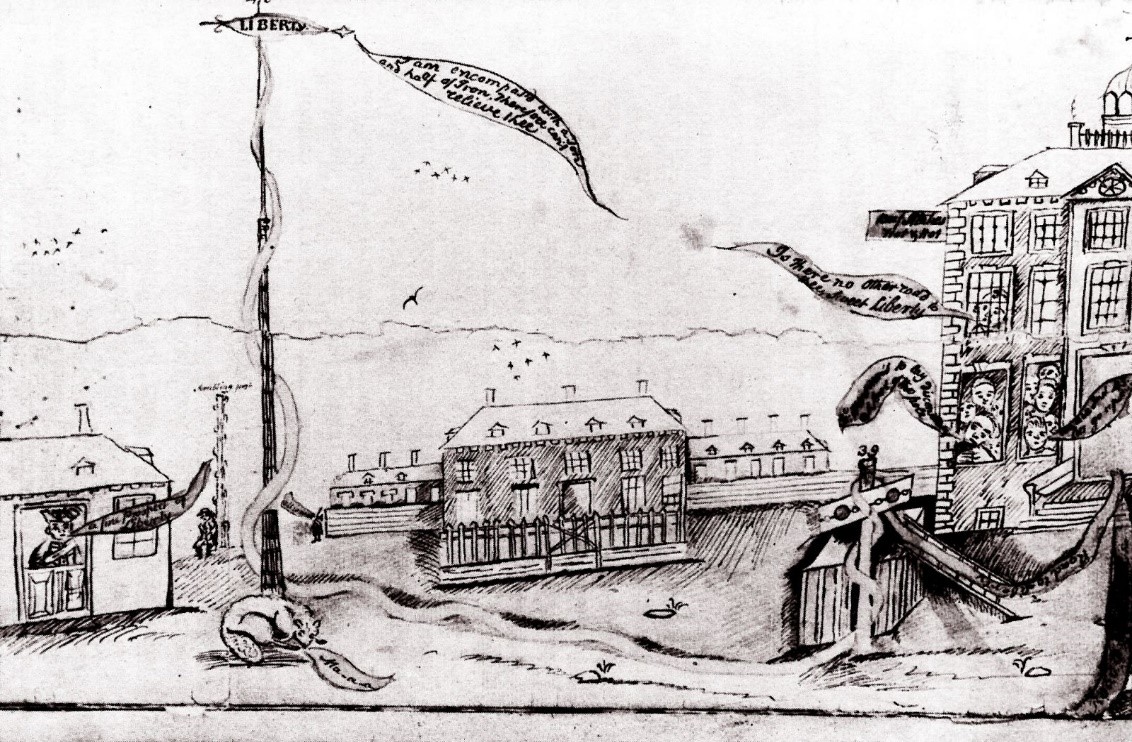 A crude town square with a large pole in the center. A ribbon wrapped around it says A crude town square with a large pole in the center. A ribbon wrapped around it says