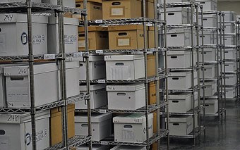 Hundreds of boxes sit on shelves in rows inside the collection facilities at Fort Stanwix.