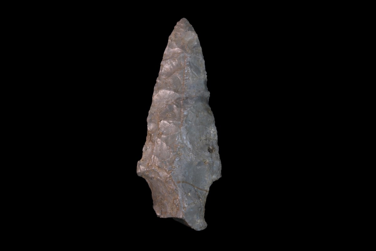 Archaic Lamoka Projectile Point (Fort Stanwix National Monument Museum Collection FOST 1984) Elongated arrowhead projectile point made of stone.