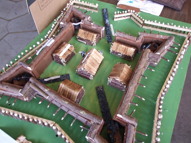 A brown cardboard model of a star-shaped for, as seen from above. A brown cardboard model of a star-shaped for, as seen from above.