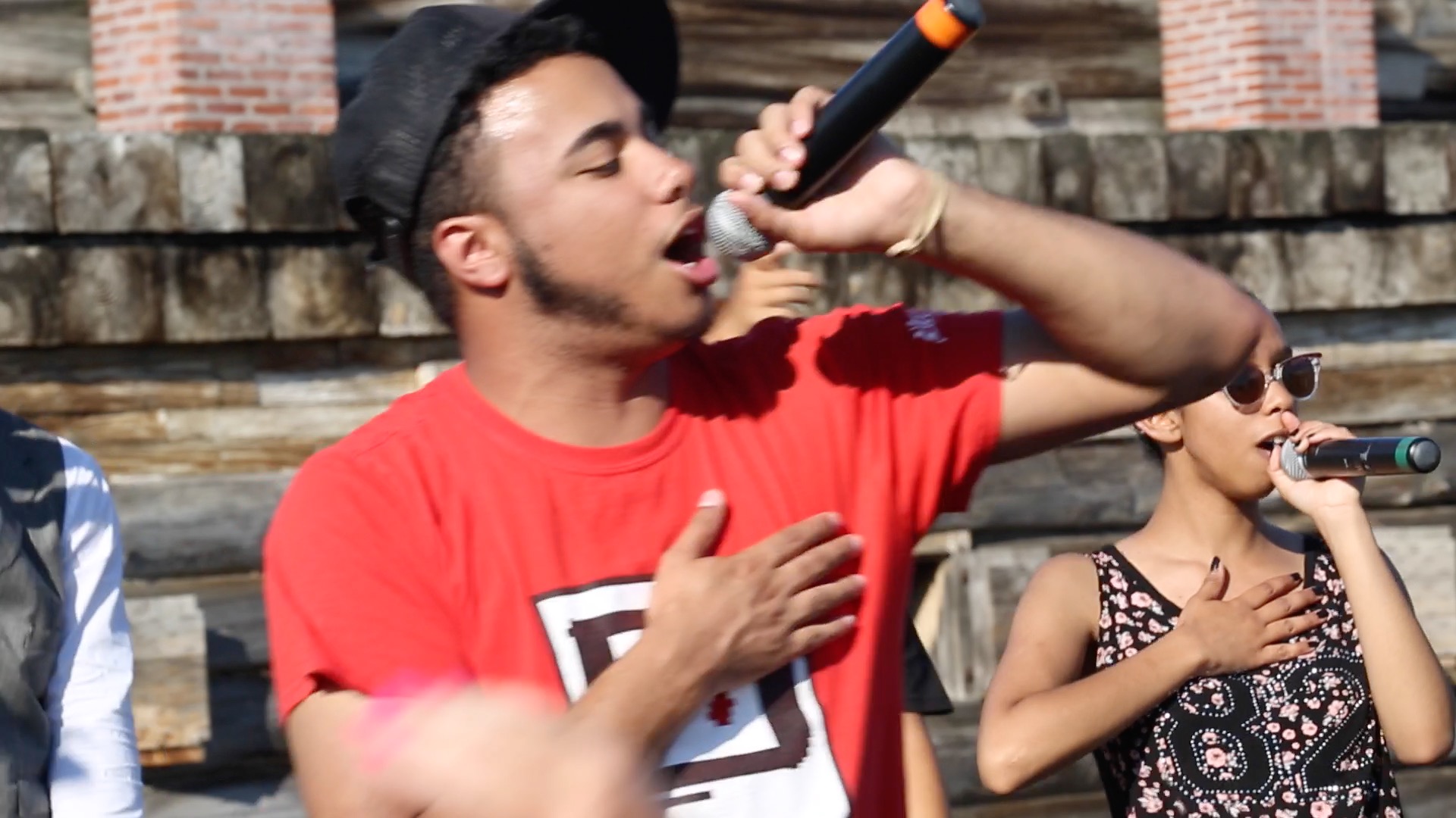 two people dance on a stage in the middle of the fort.