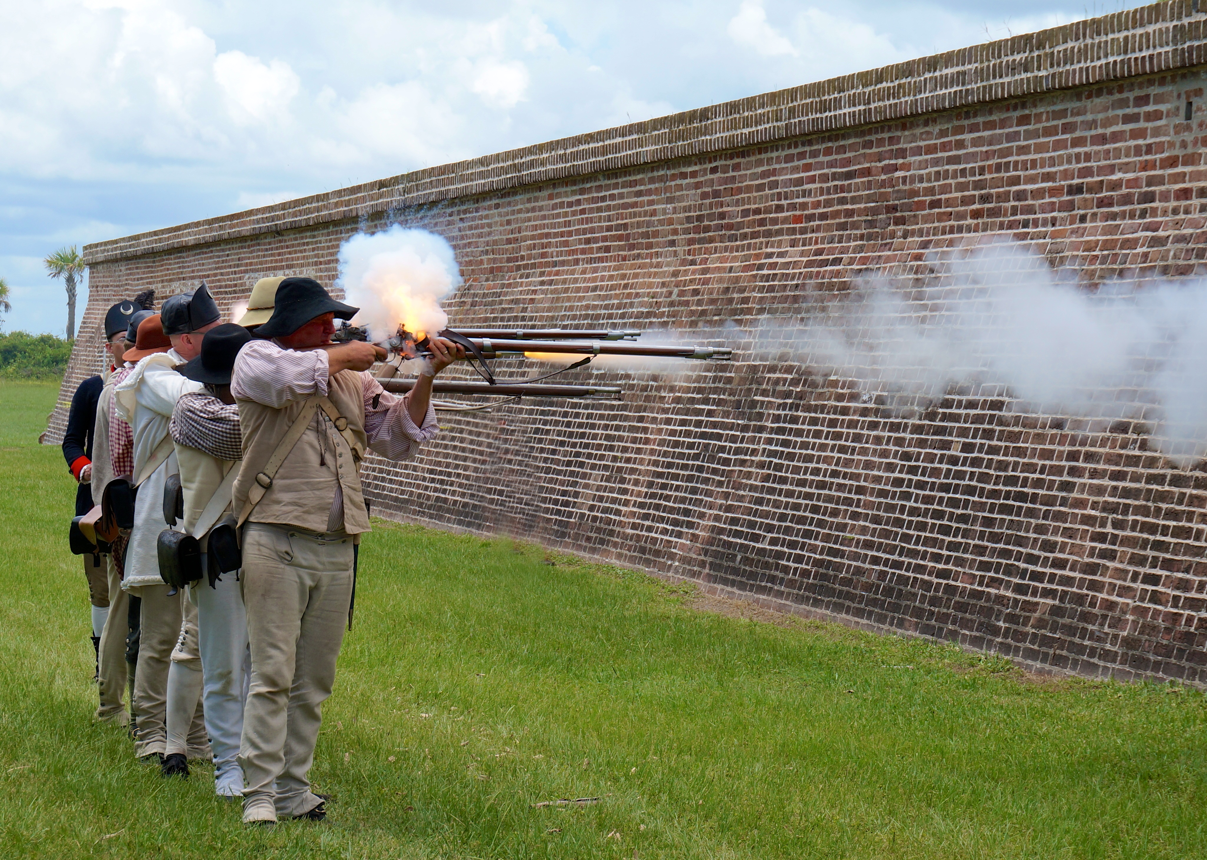 Reenactors firing muskets Reenactors firing muskets