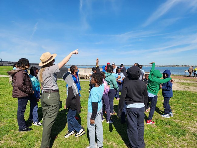 A Park Ranger speaks with a school group