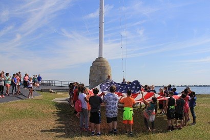 students with u.s. flag