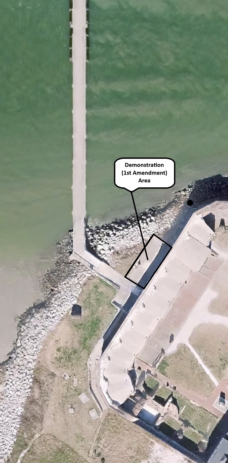 Aerial View of Fort Sumter, the island and dock. The 1st Amendment area is marked outside of the fort to the left of the sally port. This area is marked with a black outline.